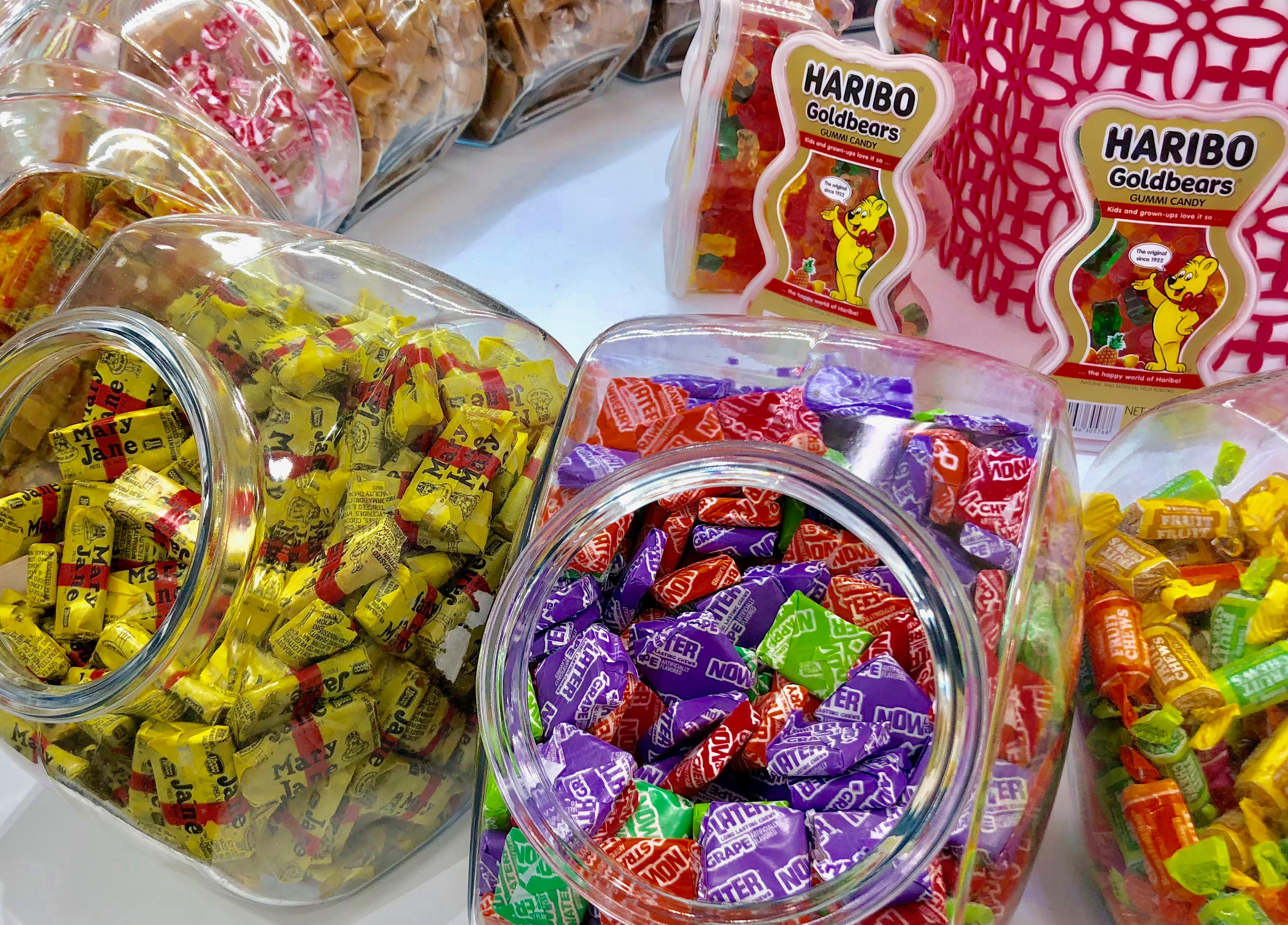 Assorted candies and sweets in containers.