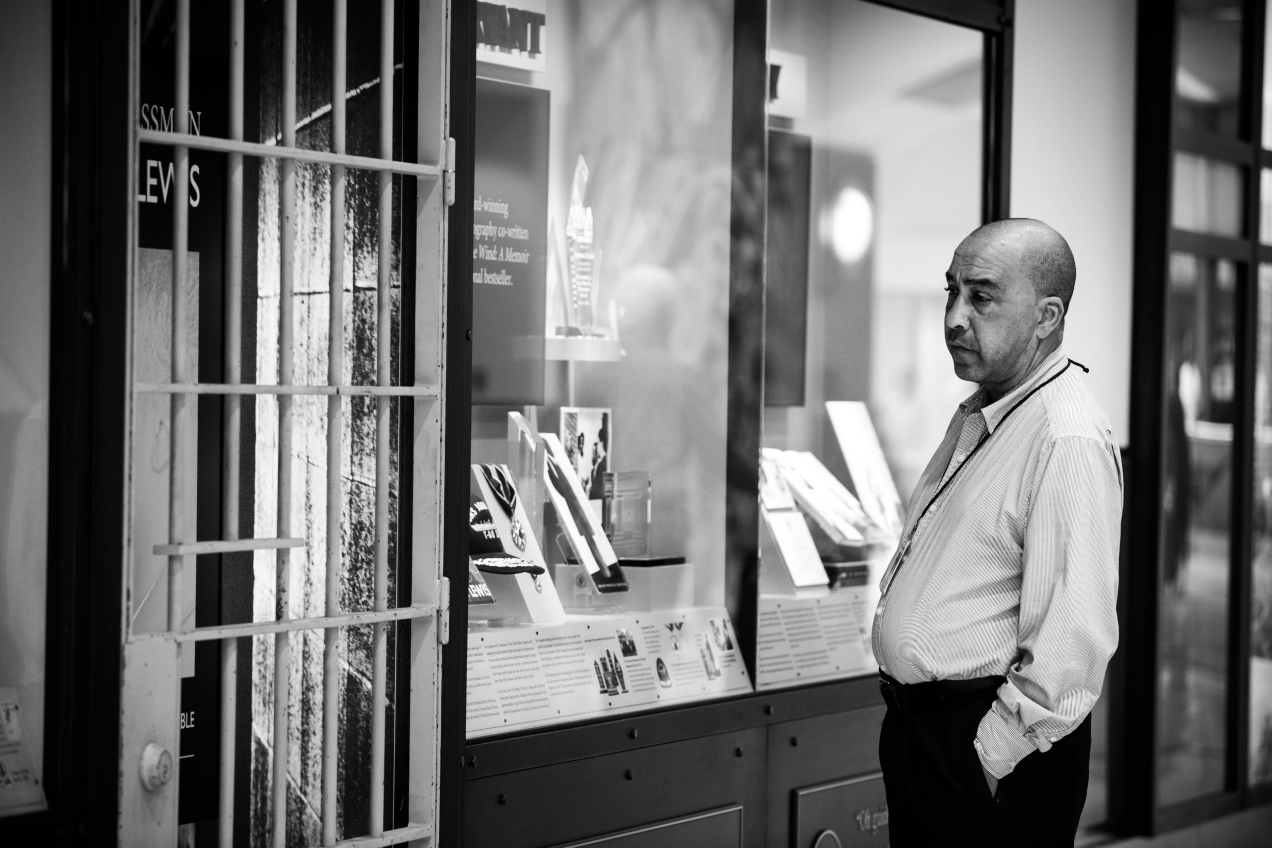 Airport employee looking at tribute wall